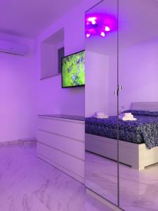 A television and/or entertainment centre at The Cove 1.3km from beach