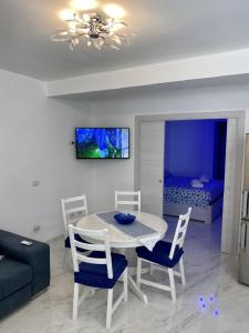 A television and/or entertainment centre at The Cove 1.3km from beach
