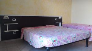 Posteľ alebo postele v izbe v ubytovaní Room in BB - Quadruple room in Pineto - A few meters from the sea