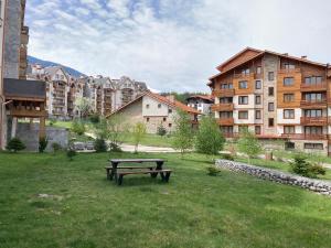 a park with a picnic table in the grass at Mirabell Studio Bansko - Amazing view & fireplace in Bansko