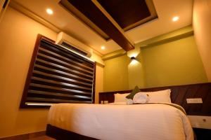 Zubis Inn Hotel客房内的一张或多张床位