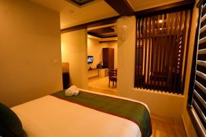 Giường trong phòng chung tại Zubis Inn Hotel