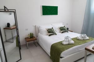 Postel nebo postele na pokoji v ubytování Family Green Suite