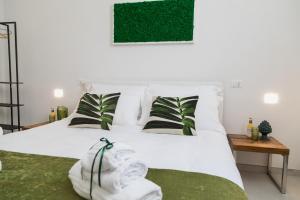 Postel nebo postele na pokoji v ubytování Family Green Suite