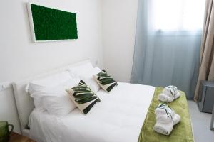 Postel nebo postele na pokoji v ubytování Family Green Suite