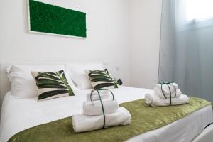 Postel nebo postele na pokoji v ubytování Family Green Suite