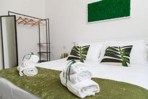 Postel nebo postele na pokoji v ubytování Family Green Suite