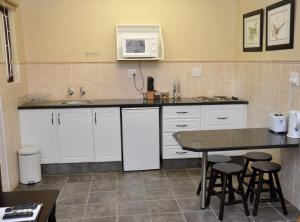 A kitchen or kitchenette at Birds of Paradise B&B