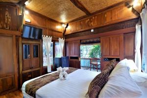 מיטה או מיטות בחדר ב-Hotel and Villa B52 Gili Air