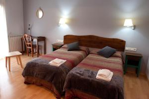 Postel nebo postele na pokoji v ubytování Hotel Seva