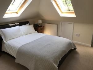 a bedroom with a bed and a window at Alba House in Edinburgh