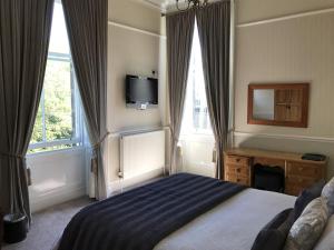 Postel nebo postele na pokoji v ubytování Alba House Hotel