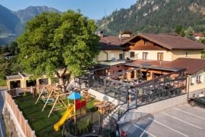 an aerial view of a building with a playground at Hotel Hubertus in Sankt Johann im Pongau