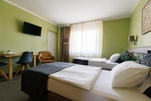 Postel nebo postele na pokoji v ubytování Spa Hotel Ezeri