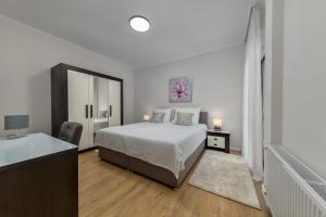 a bedroom with a bed and a dresser at Villa Madison in Zagreb