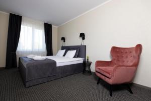 Postel nebo postele na pokoji v ubytování Spa Hotel Ezeri