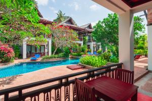 a view from the balcony of a villa with a swimming pool at Railay Village Resort in Railay Beach