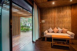 a living room with a couch and a table at Railay Village Resort in Railay Beach
