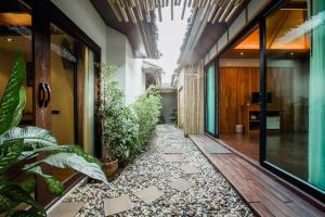 an internal courtyard of a house with plants at Railay Village Resort in Railay Beach