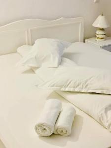 Tempat tidur dalam kamar di Hotel Green House