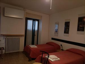 Postel nebo postele na pokoji v ubytování Albergo Roma