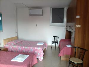 Postel nebo postele na pokoji v ubytování Albergo Roma