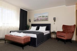 Postel nebo postele na pokoji v ubytování Spa Hotel Ezeri