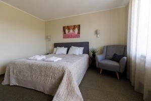 Postel nebo postele na pokoji v ubytování Spa Hotel Ezeri