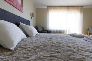 Postel nebo postele na pokoji v ubytování Spa Hotel Ezeri