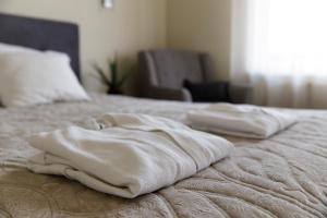 Postel nebo postele na pokoji v ubytování Spa Hotel Ezeri