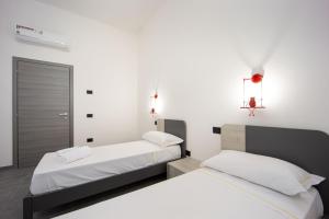 Posteľ alebo postele v izbe v ubytovaní Coru e Mari 2 Apartments