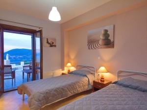 Postel nebo postele na pokoji v ubytování Villa Fiscardo View Fiscardo Kefalonia
