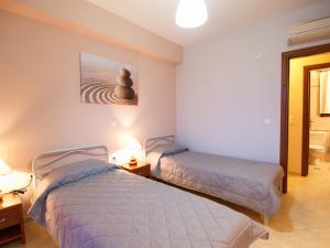 Postel nebo postele na pokoji v ubytování Villa Fiscardo View Fiscardo Kefalonia