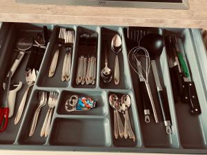 a utensil tray with utensils and utensils at Haus am Sandhügel in Lingen