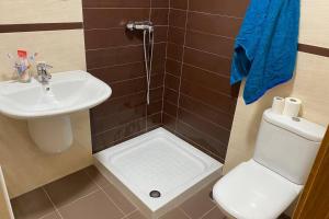 a bathroom with a sink and a toilet at Apartamento en Boiro in Boiro