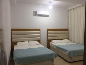Tempat tidur dalam kamar di Antalya Belek Mermaid Villas 3 Bedrooms close The Beac Park