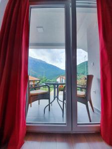a view of a balcony with a table and chairs at Kale Apartments Trpejca SUP and bikes included in Ohrid