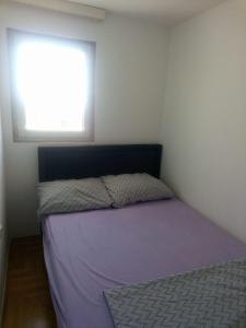Postel nebo postele na pokoji v ubytování Apartments Tomisa