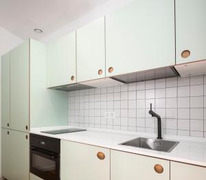 A kitchen or kitchenette at Don Fadrique Apartments by Olala Homes