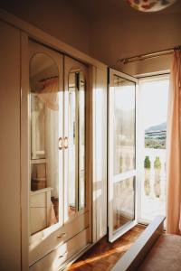a room with glass doors and a large window at Apartment Blanka with a beautiful view of Trogir in Trogir