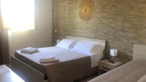 Postel nebo postele na pokoji v ubytování Messapia Casa Vacanze