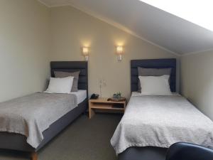 Postel nebo postele na pokoji v ubytování Spa Hotel Ezeri
