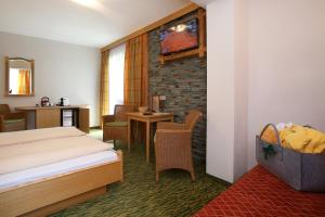 Łóżko lub łóżka w pokoju w obiekcie Hotel Eder Michaela