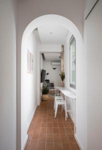 A television and/or entertainment centre at Don Fadrique Apartments by Olala Homes