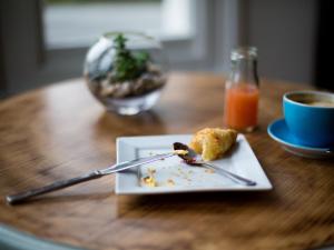 a plate of food on a table with a fork and knife at The Smugglers Rest in Woolacombe