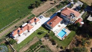 an aerial view of a house with a swimming pool at Maison Kronio Lassithi Plateau in Marmakéton
