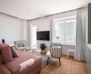 A television and/or entertainment centre at Don Fadrique Apartments by Olala Homes