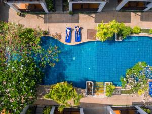 an overhead view of a swimming pool with umbrellas at Railay Village Resort in Railay Beach