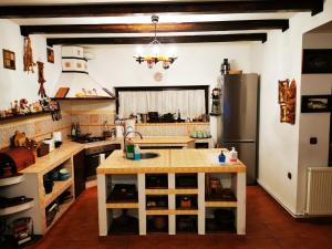 a kitchen with a counter and a refrigerator at Casa Veveritelor in Predeluţ