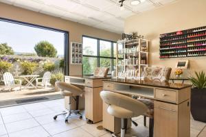 a wine tasting room with a table and chairs at Silverado Resort in Napa